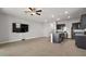 Spacious living room with tile floor and open kitchen at 5427 Dragonfly Dr, Wildwood, FL 34785