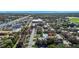 Aerial view showing apartment building, pool, and surrounding area at 5600 Devonbriar Way # 204, Orlando, FL 32822