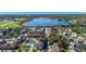 Aerial view of apartment building showcasing its location near a lake at 5600 Devonbriar Way # 204, Orlando, FL 32822