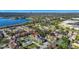 Apartment building complex near a lake with city skyline in the background at 5600 Devonbriar Way # 204, Orlando, FL 32822