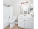 Clean bathroom with white vanity and bathtub at 5600 Devonbriar Way # 204, Orlando, FL 32822