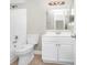 Clean bathroom with white vanity and bathtub at 5600 Devonbriar Way # 204, Orlando, FL 32822