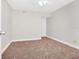 Simple bedroom with carpeted floor and ceiling fan at 5600 Devonbriar Way # 204, Orlando, FL 32822