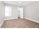 Spacious bedroom with neutral walls and carpeted floor at 5600 Devonbriar Way # 204, Orlando, FL 32822