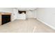 Living room with tile floors, fireplace and view into kitchen area at 5600 Devonbriar Way # 204, Orlando, FL 32822