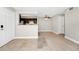 Open living room and kitchen area with tile floors and a fireplace at 5600 Devonbriar Way # 204, Orlando, FL 32822