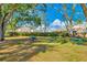 Relaxing picnic area with tables under the trees at 5600 Devonbriar Way # 204, Orlando, FL 32822