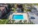 Community pool with surrounding patio at 5600 Devonbriar Way # 204, Orlando, FL 32822