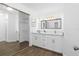 Modern bathroom with double vanity and large mirror at 670 Sandy Neck Ln # 103, Altamonte Springs, FL 32714