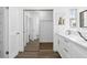 Bright bathroom with double vanity, large mirror, and walk-in shower at 670 Sandy Neck Ln # 103, Altamonte Springs, FL 32714