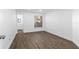 Spacious bedroom with wood-look floors and access to bathroom at 670 Sandy Neck Ln # 103, Altamonte Springs, FL 32714