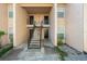 Condo building entrance with stairs and multiple unit doors at 670 Sandy Neck Ln # 103, Altamonte Springs, FL 32714