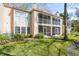 Exterior view of the building with lush landscaping at 670 Sandy Neck Ln # 103, Altamonte Springs, FL 32714
