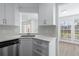 Kitchen corner sink with view into living room at 670 Sandy Neck Ln # 103, Altamonte Springs, FL 32714