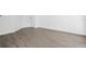 Spacious living room with wood-look floors and access to patio at 670 Sandy Neck Ln # 103, Altamonte Springs, FL 32714