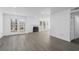 Bright living room with fireplace, wood-look floors and patio doors at 670 Sandy Neck Ln # 103, Altamonte Springs, FL 32714
