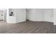 Living room with kitchen access and wood-look floors at 670 Sandy Neck Ln # 103, Altamonte Springs, FL 32714