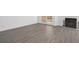 Living room with fireplace and wood-look floors and access to patio at 670 Sandy Neck Ln # 103, Altamonte Springs, FL 32714