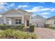 Two-story house with a large front porch and attached two-car garage at 8013 Navel Orange Ln, Winter Garden, FL 34787