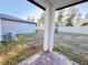 View of backyard from covered patio; showing AC unit and fence at 849 Rivers Crossing St, Clermont, FL 34714