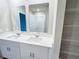 Double vanity bathroom with a walk-in shower and wire shelving at 849 Rivers Crossing St, Clermont, FL 34714