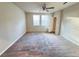 Large bedroom with a ceiling fan and carpet flooring at 849 Rivers Crossing St, Clermont, FL 34714