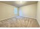 Carpeted bedroom with window and light at 849 Rivers Crossing St, Clermont, FL 34714