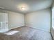 Well-lit bedroom with carpet flooring at 849 Rivers Crossing St, Clermont, FL 34714