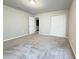 Spacious bedroom with carpet flooring and double door closet at 849 Rivers Crossing St, Clermont, FL 34714