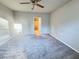 Spacious bedroom with ceiling fan and carpet flooring at 849 Rivers Crossing St, Clermont, FL 34714