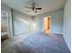 Bright bedroom with ceiling fan and carpet flooring at 849 Rivers Crossing St, Clermont, FL 34714