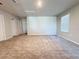 Bonus room with carpet flooring and access to additional rooms at 849 Rivers Crossing St, Clermont, FL 34714