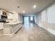 Open concept kitchen with island, stainless steel appliances, and tile flooring at 849 Rivers Crossing St, Clermont, FL 34714