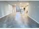Open living room with tile flooring and kitchen views at 849 Rivers Crossing St, Clermont, FL 34714