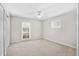 Well-lit bedroom with carpet flooring and ceiling fan at 8857 Butternut Blvd, Orlando, FL 32817