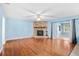 Living room with fireplace and hardwood floors at 8857 Butternut Blvd, Orlando, FL 32817