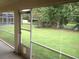 View of the backyard from covered porch at 11618 Grand Bay Blvd, Clermont, FL 34711