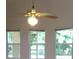 Bedroom featuring ceiling fan and windows at 11618 Grand Bay Blvd, Clermont, FL 34711