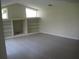 Bright living room features modern floors, built-in shelves and large windows at 11618 Grand Bay Blvd, Clermont, FL 34711