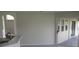 Bright open-concept living space featuring access to a patio via sliding glass doors at 11618 Grand Bay Blvd, Clermont, FL 34711