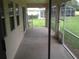 Covered porch with view of backyard at 11618 Grand Bay Blvd, Clermont, FL 34711