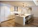 Modern kitchen featuring an island with seating, stainless steel appliances, and a sleek design at 10601 Autumn Mist Ln # 302, Golden Oak, FL 32836