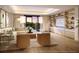 Bright, contemporary living room featuring built-in shelving, neutral tones, and a serene outdoor view at 10601 Autumn Mist Ln # 302, Golden Oak, FL 32836