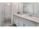 Clean bathroom with double sinks and a shower/tub combo at 1016 Downswing Pl, Davenport, FL 33896