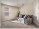 Cozy bedroom with a comfortable sofa and plenty of natural light at 1016 Downswing Pl, Davenport, FL 33896
