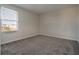 Spacious bedroom with neutral walls and carpet, offering ample natural light at 1016 Downswing Pl, Davenport, FL 33896