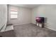 Versatile bedroom with plush carpeting, perfect for guests or a home office at 1016 Downswing Pl, Davenport, FL 33896