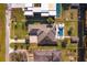 Aerial view of the property showcasing the home, pool, outdoor areas, and the surrounding landscape at 10416 Pocket Ln, Orlando, FL 32836