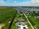 Scenic aerial view of a waterfront community with beautiful homes and lush, green landscaping at 10416 Pocket Ln, Orlando, FL 32836