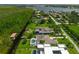 Aerial view featuring luxury homes nestled among lush greenery and waterfront access in a serene neighborhood at 10416 Pocket Ln, Orlando, FL 32836